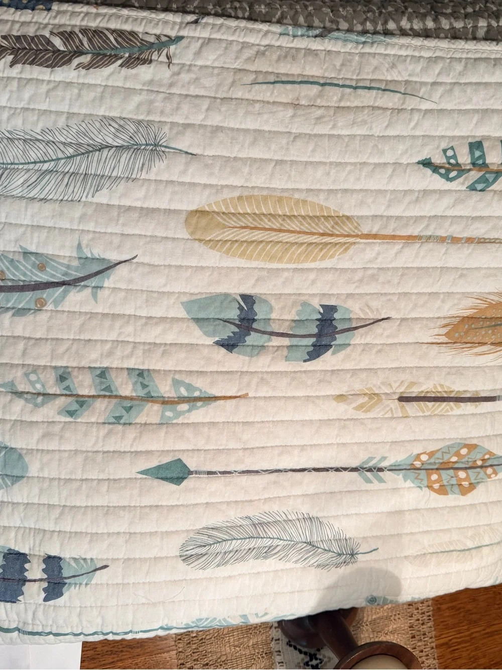 Rod’s True Western Feather and Arrow print quilt in Cream, Teal & Mustard.